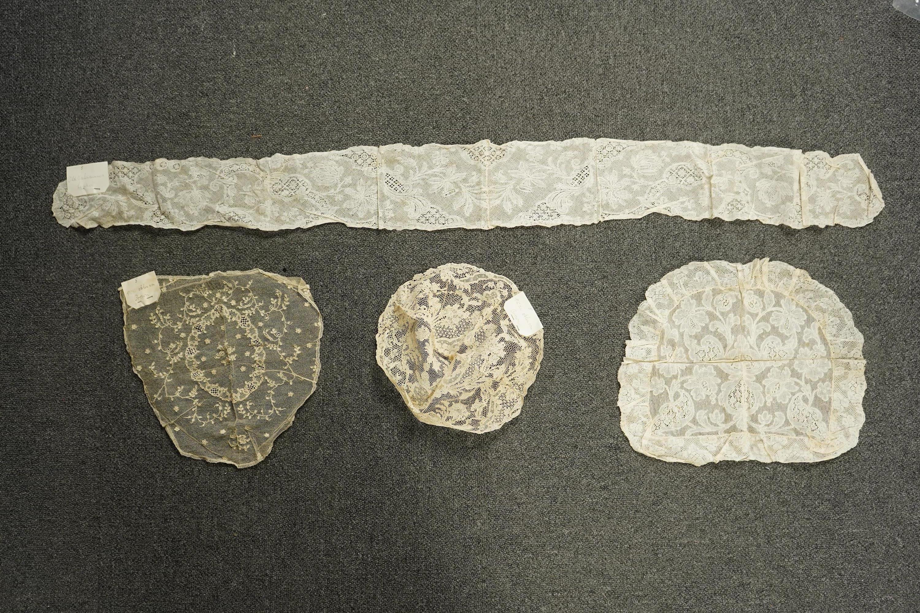 A collection of 18th century needle and bobbin lace. Including an 18th century wide pair of joined Valenciennes lace lappets, a similar 18th century cap back, an ornately worked Point de Alencon cap crown and another sim